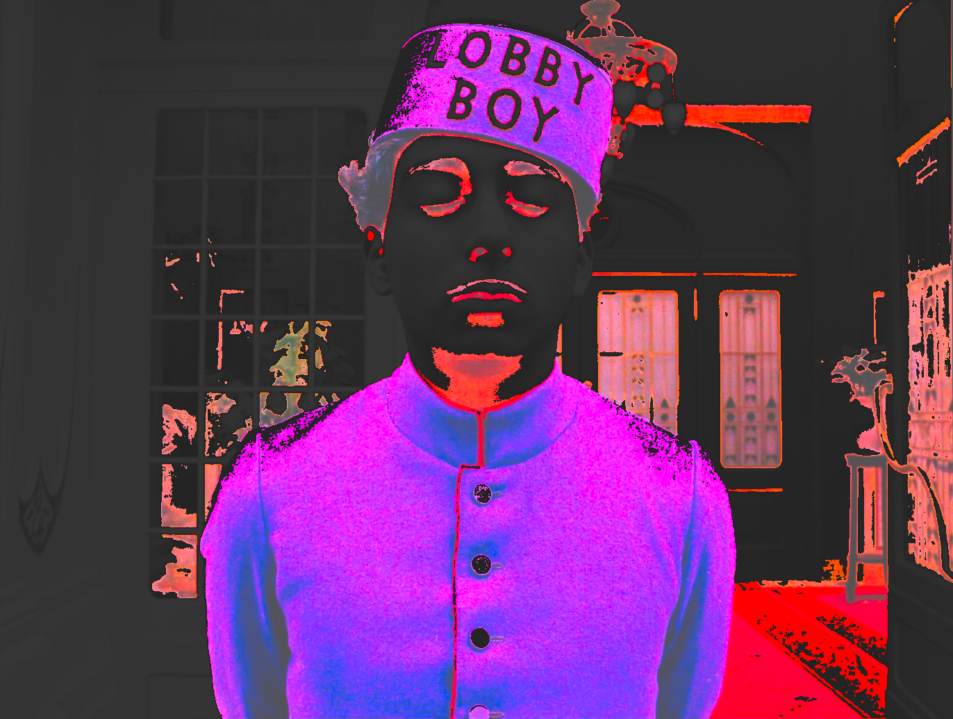 A young man in a purple uniform and cap, eyes closed, with the dark of his uniform lifted to a vivid magenta-violet.