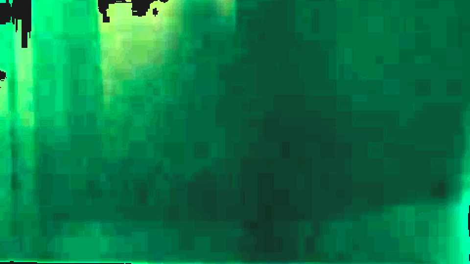 The same green interior from the web copy, broken into square blocks in the darkest areas.