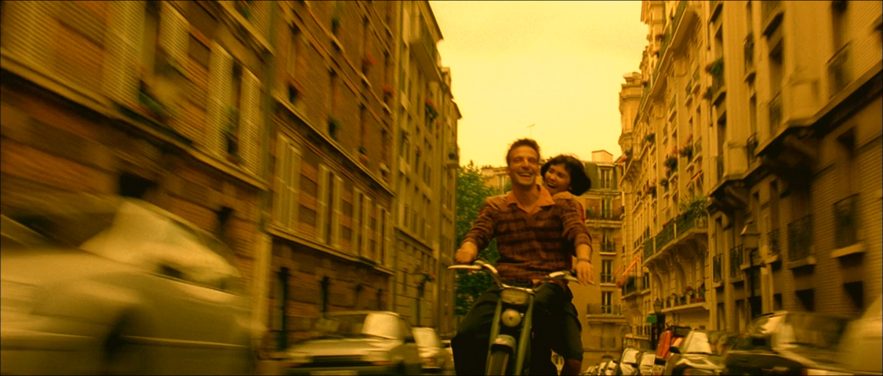 A scooter crossing a Paris street rendered in saturated golden light.